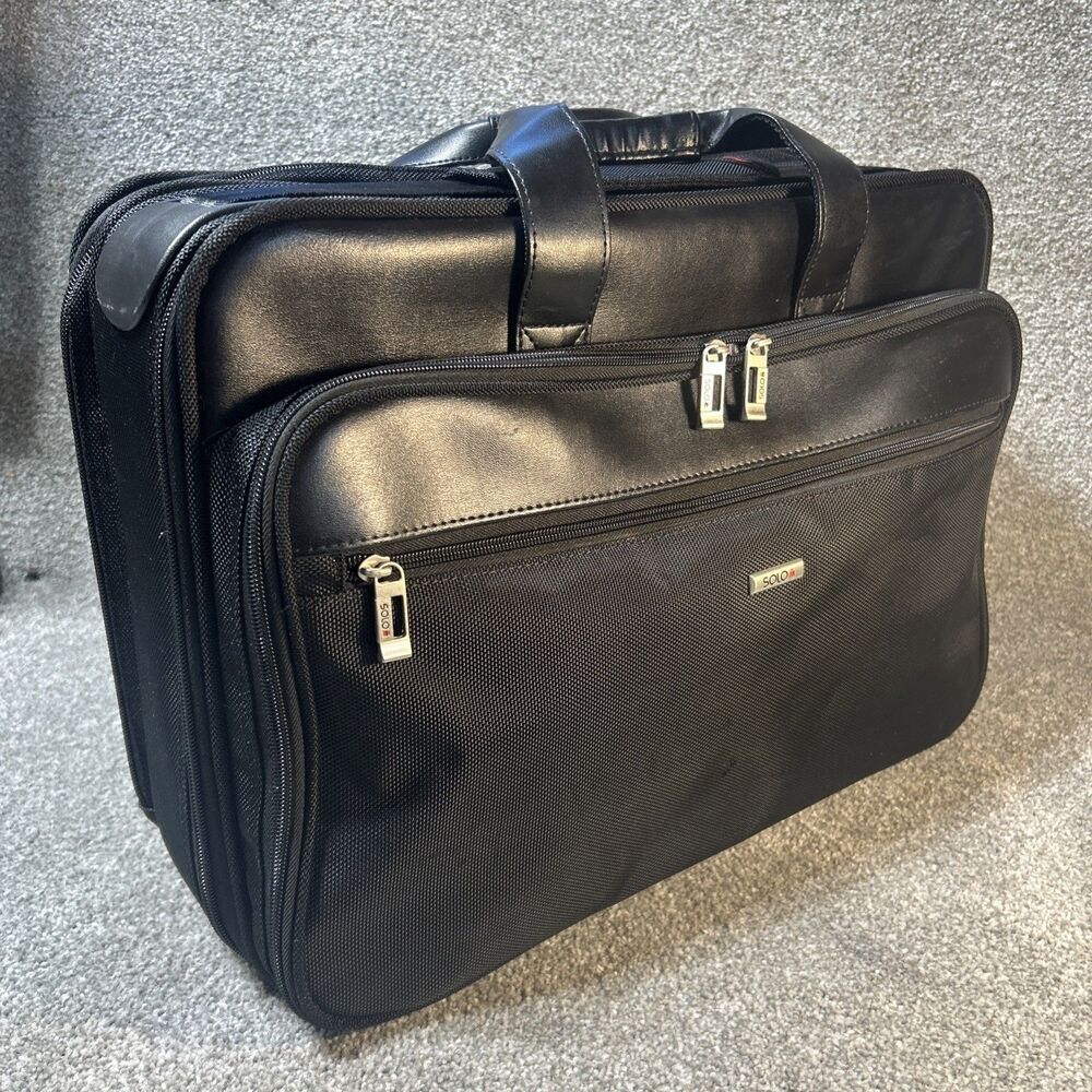 Tumi Solo briefcase computer bag well appointed 13 x 17" retractable strap